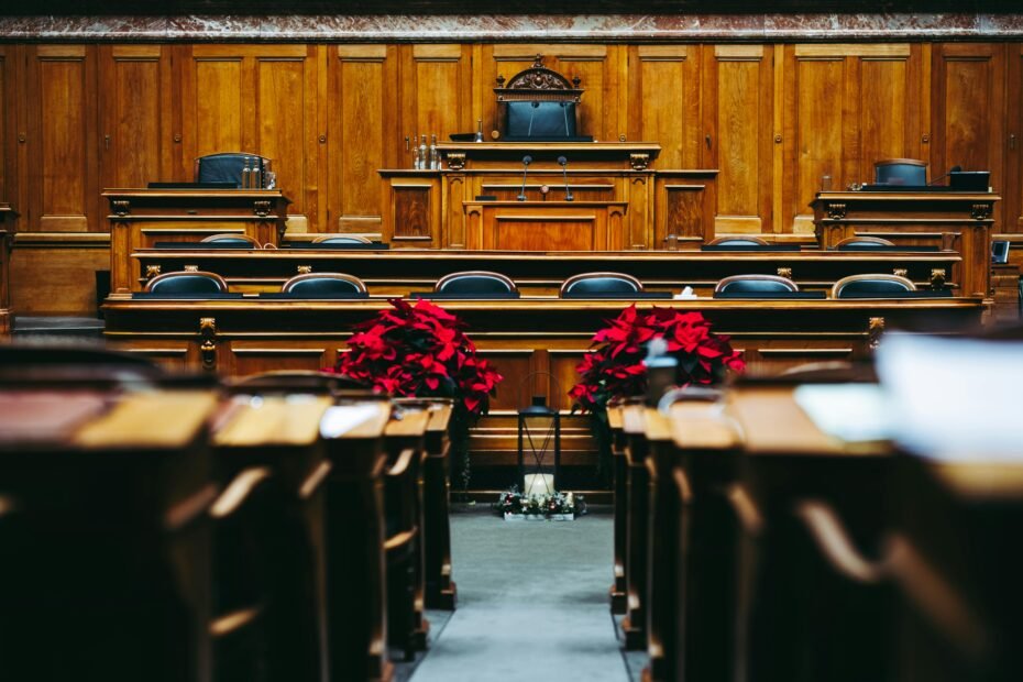 Spacious and elegant wooden courtroom with empty seats, located in Bern, Switzerland.